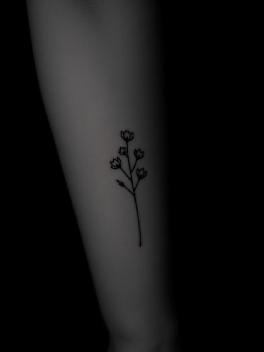 Fine line botanical tattoo